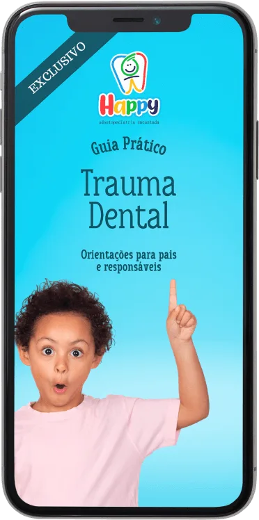 Capa do ebook “Guia Prático de Trauma Dental” exibida na tela de um celular
